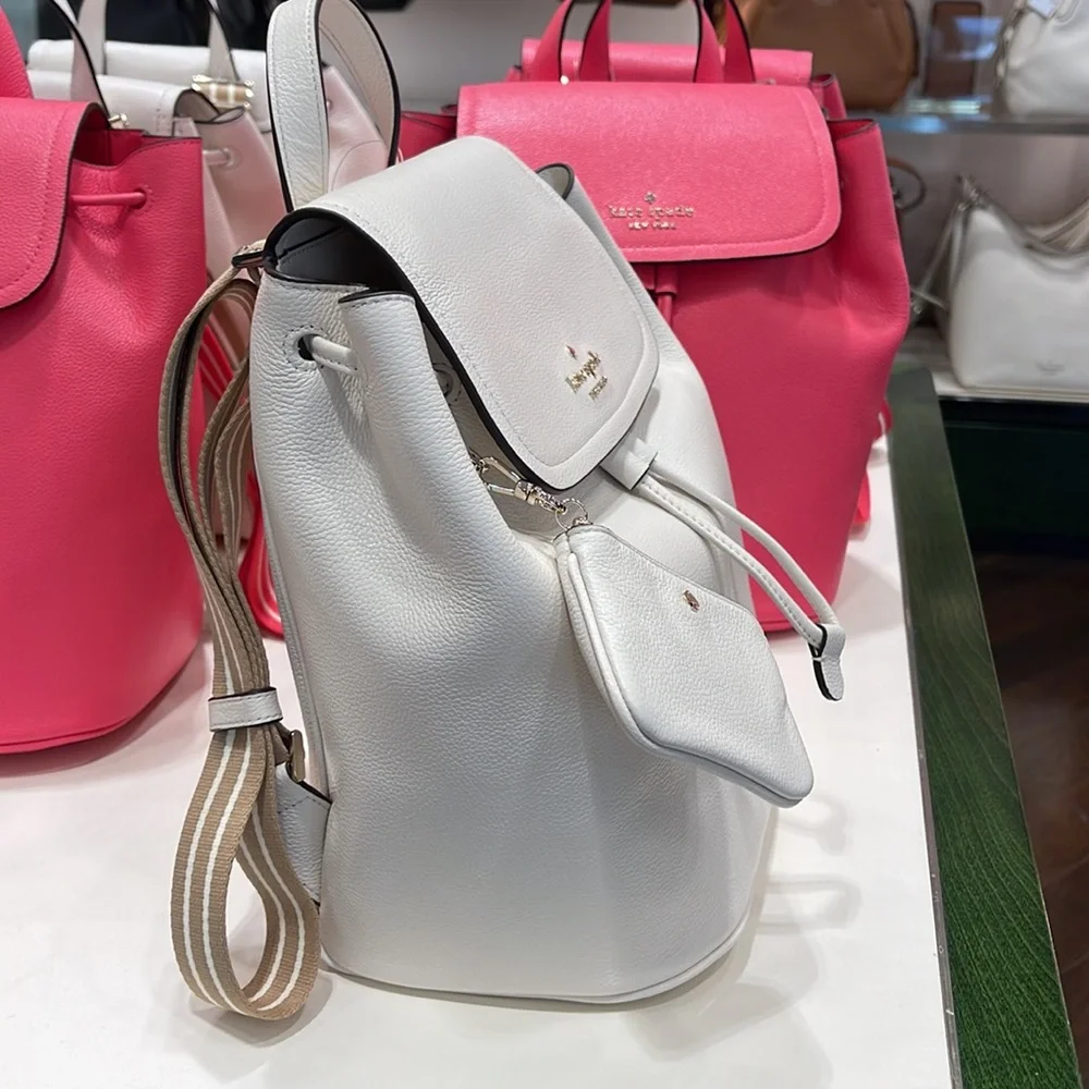 Kate Spade Rosie Medium Flap Backpack 
K8714 pebbled leather Parchment rosie
NWT - Picture 4 of 16